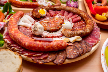 Traditional sausages are arranged with various smoked meat for review at food contest