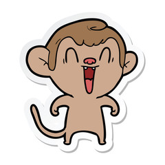 sticker of a cartoon laughing monkey