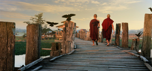 monks walking on U bein bridge at Mandalay,Myanmar