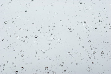 Water drops on clean bright window focused detail