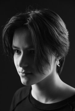Impulsive portrait of a beautiful young girl with short hair