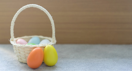 close up group of egg in basket on grey color carpet in home background for celebrate easter day concept