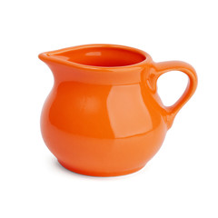 Ceramic orange jug on white background