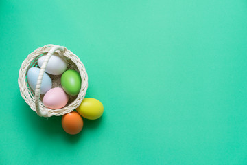 Close up top view of group chicken eggs on green color background for celebrate easter day concept	