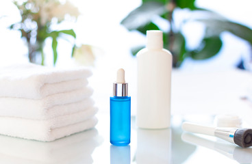 Cosmetic bottles in the bathroom close up. Concept beauty composition