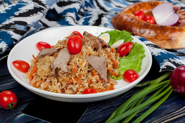 Pilaf. Meat dish of the peoples of Central and Central Asia, rice, meat and onions, suitable for the Nauryz or Navruz holidays, as well as during the Holy month of Ramadan and the holidays of Uraz Ait