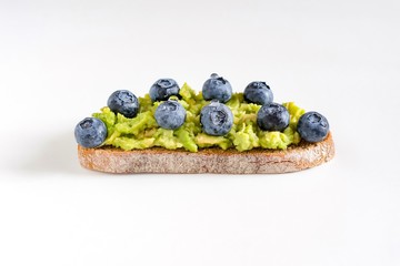 Fresh delicious  sandwich with blueberry and avocado.