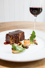Beef brisket with mushrooms, sage and a glass of red wine