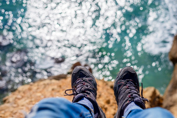 Above view of a man legs over the sea.