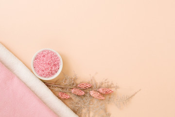 Bath pampering. Body health and relaxation. Copy space on coral pink background.