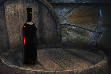 Red wine bottle on a old barrel table background wood wall.