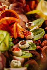 Meat platter with selection delicious salami, ham, fresh sausages and herb