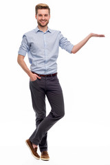 Full length portrait of young man standing on white background