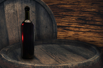 Red wine bottle on a old barrel table background wood wall.