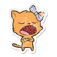 distressed sticker of a cartoon yawning cat