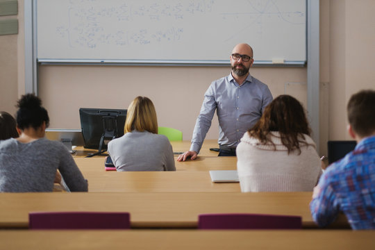 Lecturer and multinational group of students in an auditorium