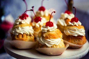 Savarin cake with cream and cherry
