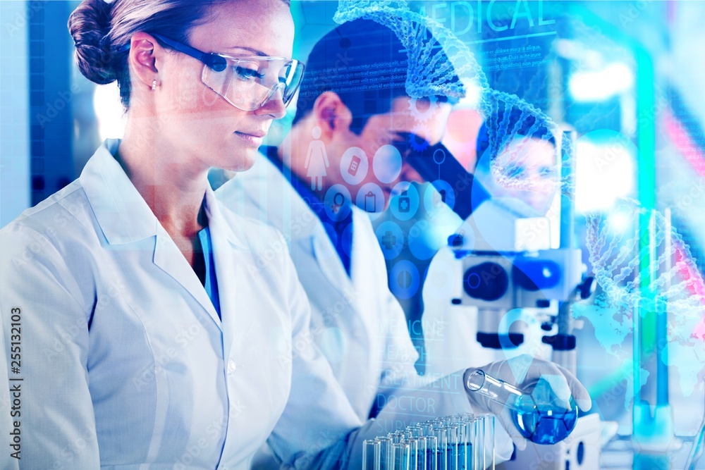 Wall mural Female and male scientists in glasses working