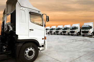 New truck fleet with container depot as for shipping and logistics transportation industry. - obrazy, fototapety, plakaty
