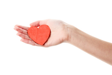 Female hand isolated on white background. White woman's hand showing symbols and gestures. Red wooden heart in hand. Love