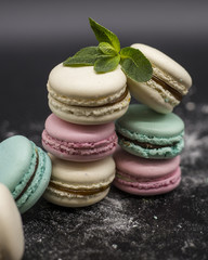 fruit macaroon with mint on black background