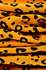 Cotton fabric with animal print. Animal pattern background or texture. Texture leopard.