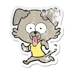 distressed sticker of a cartoon dog with tongue sticking out