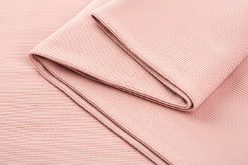 Pink cotton textile - close up of fabric texture. Cotton Fabric Texture. Top View of Cloth Textile Surface. Pink Clothing Background. Text Space. Abstract background and texture for designers.