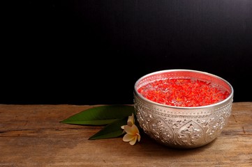 Bowl of water and flowers for songkran festival