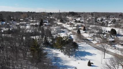 Aerial view of residential houses at winter. American neighborhood, suburb. Real estate, snow, drone shots, from above