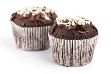 Tasty chocolate cupcakes on white background. Chocolate caramel cupcake and butterscotch syrup. Chocolate cupcake isolated on white.