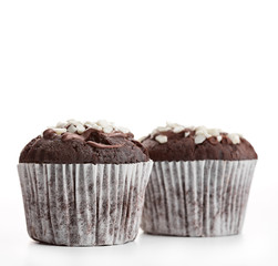 Tasty chocolate cupcakes on white background. Chocolate caramel cupcake and butterscotch syrup. Chocolate cupcake isolated on white.