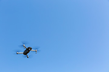 A drone flying against the blue sky