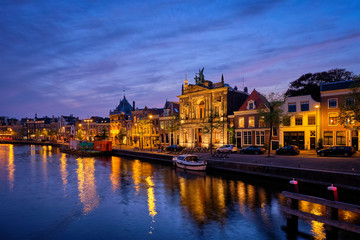 Naklejka na ściany i meble Canal and houses in the evening. Haarlem, Netherlands