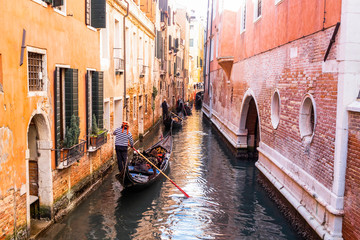 Canal with gondolas in Venice in a sunny day © Victor