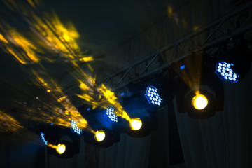 Stage lighting rig with moving heads