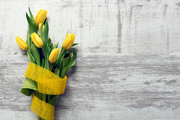 Spring flowers, yellow tulips with ribbon