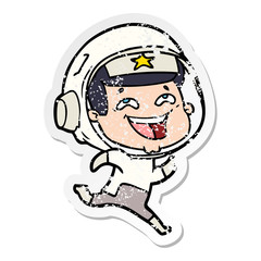 Naklejka premium distressed sticker of a cartoon laughing astronaut