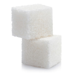 Close-up of two white sugar cubes, isolated on white background