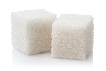 Close-up of two white sugar cubes, isolated on white background