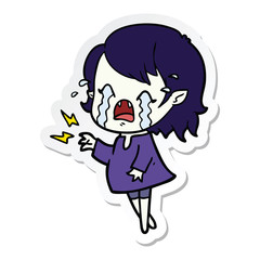 sticker of a cartoon crying vampire girl