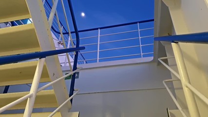 The moon is shining above the driving cruise ship