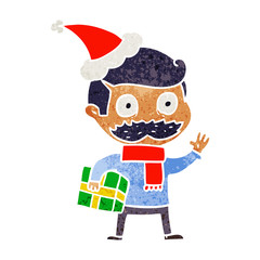 retro cartoon of a man with mustache and christmas present wearing santa hat