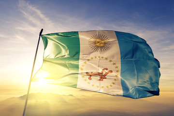 Chaco province of Argentina flag waving on the top sunrise mist fog
