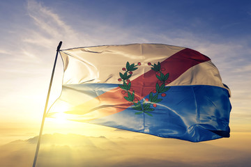 La Rioja province of Argentina flag waving on the top sunrise mist fog