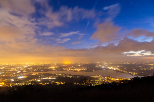 View of Varese province and the Lake District with Varese Lake from the Belvedere at Campo dei Fiori after sunset. Campo dei Fiori, Varese, Lombardy, Italy.