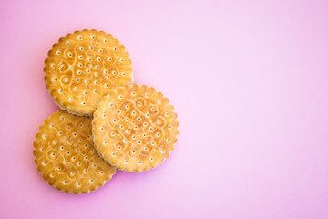 Three cookies on a pink  ground
