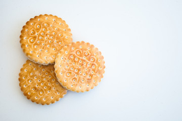 Three cookies on a white ground