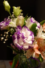 Beautiful wedding bouquet composed of different flowers on a black background.