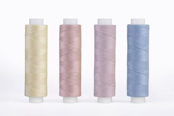 Set of sewing thread coils, miscellaneous colours, isolated on white
